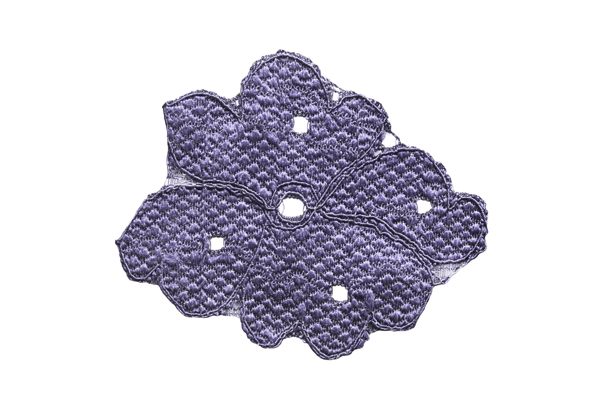 close-up of premium embroidered patch on fabric