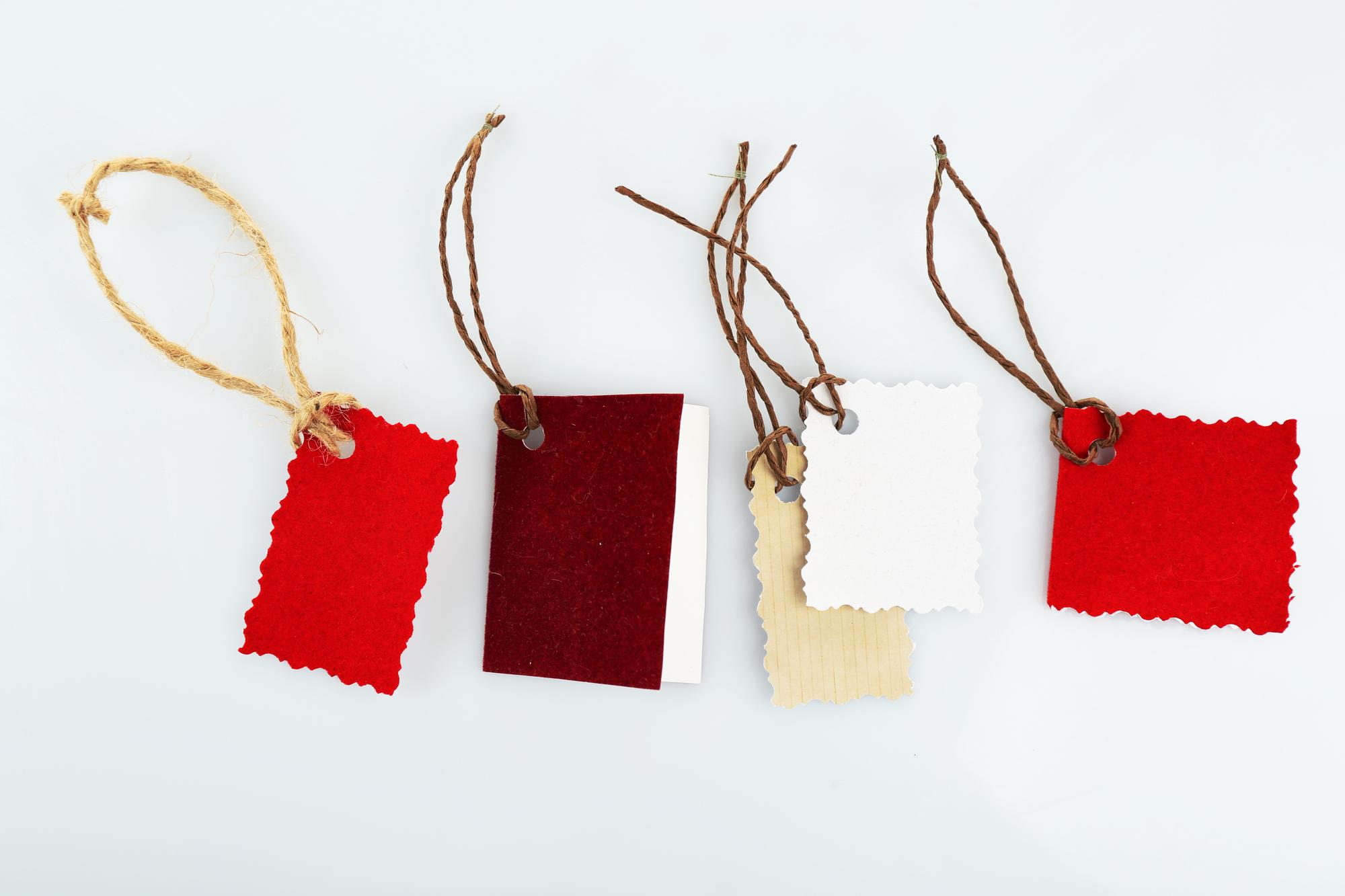 stack of embroidered samples with tags